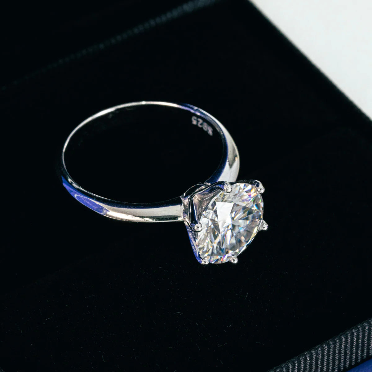 The Camille engagement ring displayed in an elegant velvet box