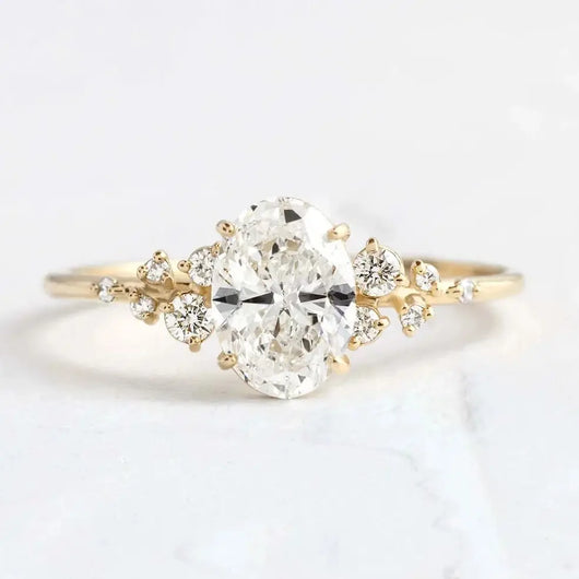 The Celeste oval cut moissanite cluster engagement ring in gold setting