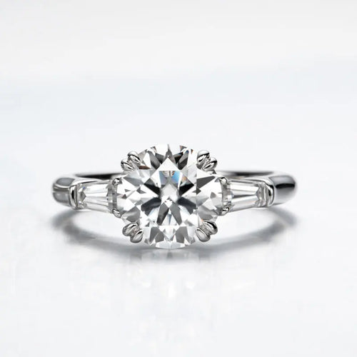 The Grace Round Cut Side Stone Moissanite Ring